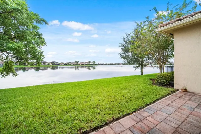 a view of a lake with houses in the back