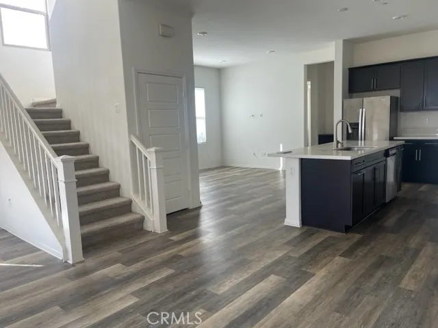 a view of kitchen and wooden floor