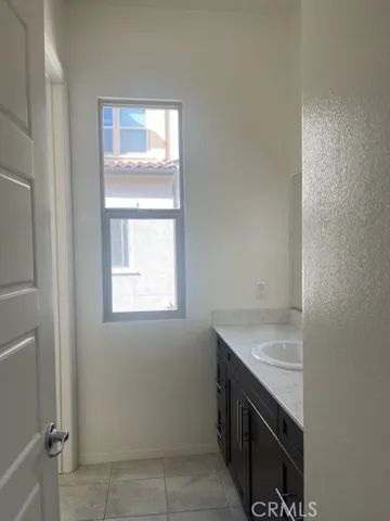 a room with a stove and a sink