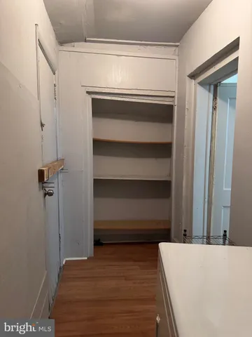 a view of bedroom and hallway