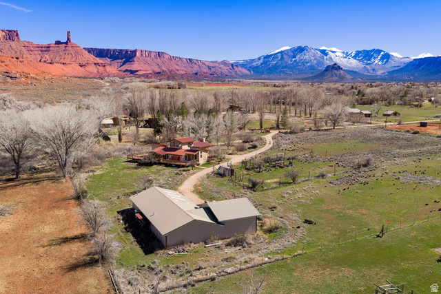 423 Amber Lane Moab, UT 84532 - Photo 50 of 63 Aerial view of home and 6 car garage with La Sal Mtns and Castleton Tower.