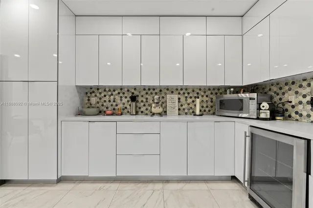 a kitchen with white cabinets