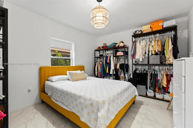 a bedroom with a bed and a closet