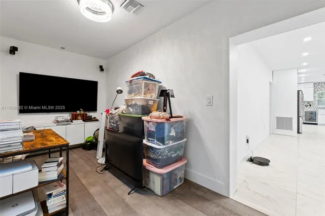 a room with furniture and a flat screen tv