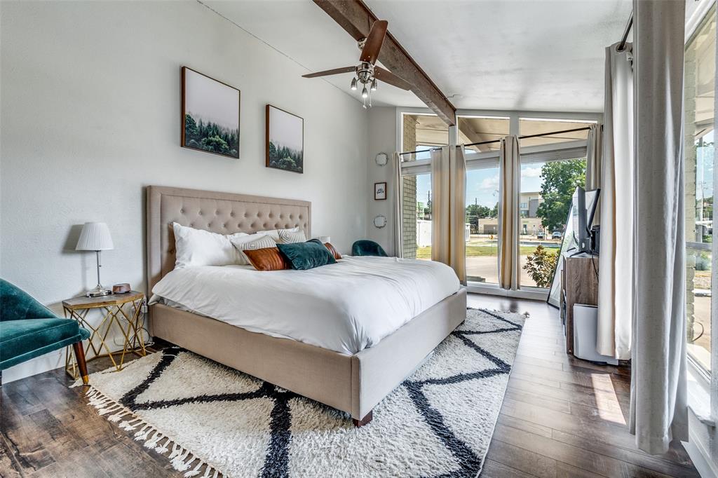 4347 Dickason Avenue, Unit 110 Dallas, TX 75219 - Photo 19 of 24 a bedroom with a large bed and a window