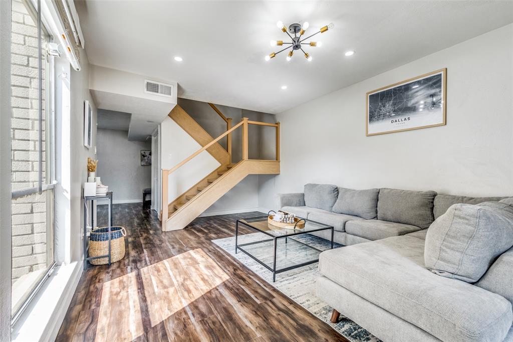 4347 Dickason Avenue, Unit 110 Dallas, TX 75219 - Photo 3 of 24 a living room with furniture and a chandelier