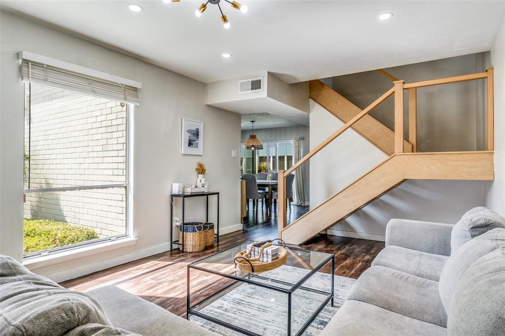 4347 Dickason Avenue, Unit 110 Dallas, TX 75219 - Photo 7 of 24 a living room with furniture and a window