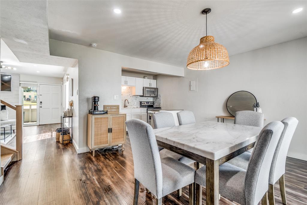 4347 Dickason Avenue, Unit 110 Dallas, TX 75219 - Photo 10 of 24 a view of a dining room with furniture and wooden floor