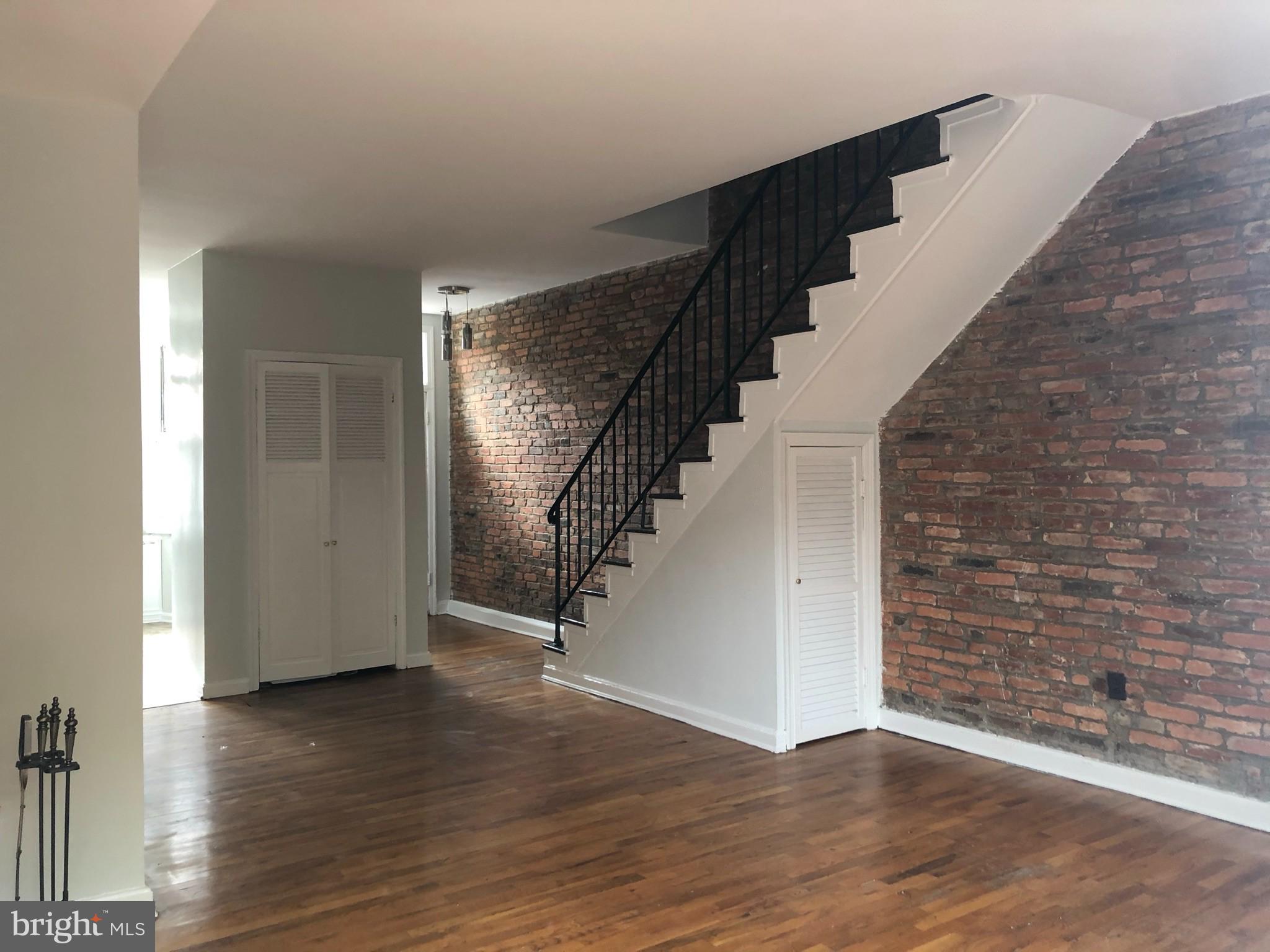 612 C Street Northeast Washington, DC 20002 - Photo 7 of 22 Exposed brick, space under staircase.