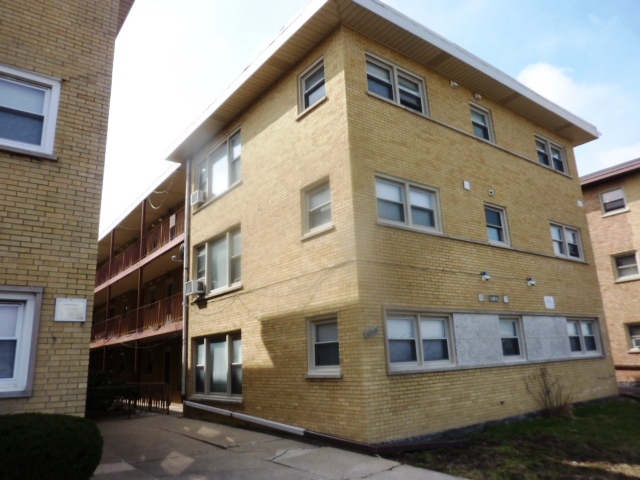 a front view of a building with a street