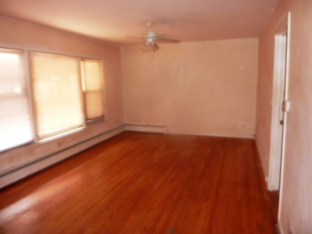 6733 West Irving Park Road, Unit 2C Chicago, IL 60634 - Photo 4 of 10 a view of an empty room with a window