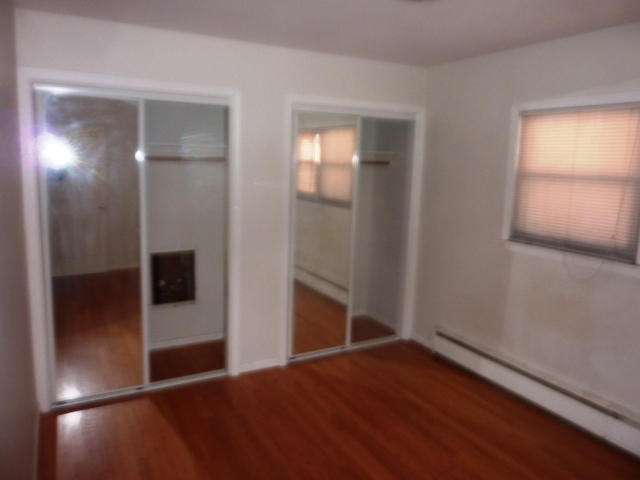 6733 West Irving Park Road, Unit 2C Chicago, IL 60634 - Photo 6 of 10 a view of empty room with wooden floor