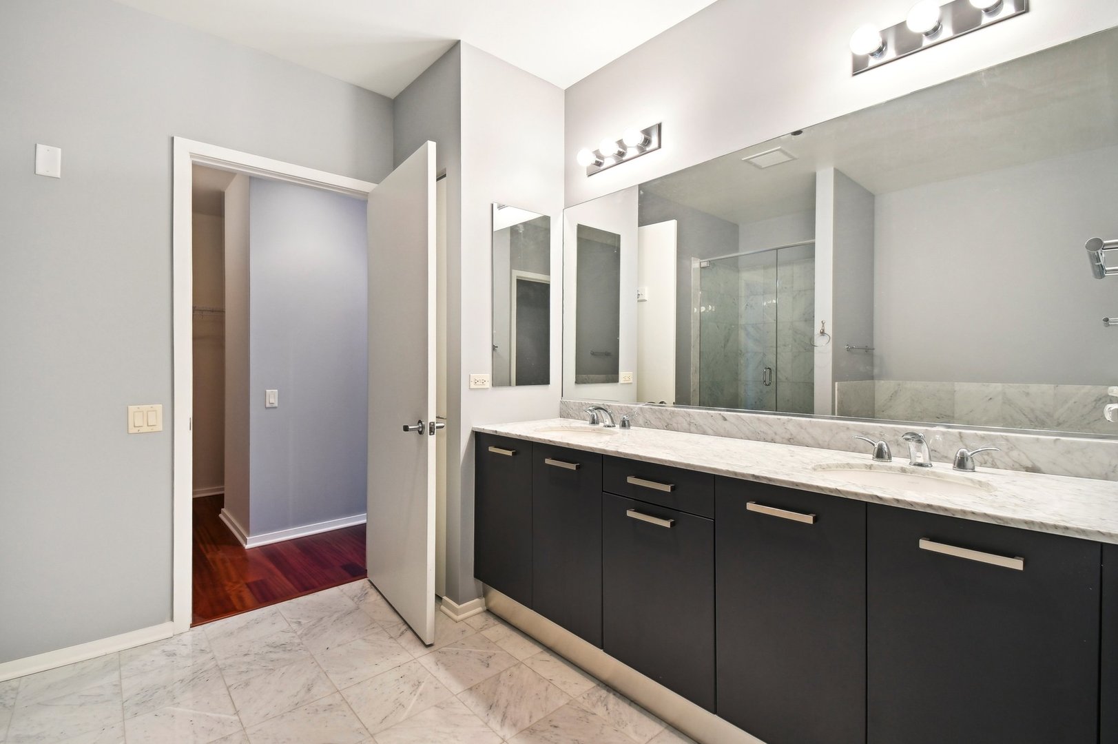 65 East Monroe Street, Unit 4521 Chicago, IL 60603 - Photo 15 of 42 a spacious bathroom with a double vanity sink mirror and double