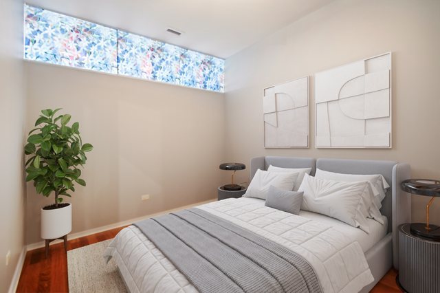 65 East Monroe Street, Unit 4521 Chicago, IL 60603 - Photo 19 of 42 a bedroom with a bed and a potted plant