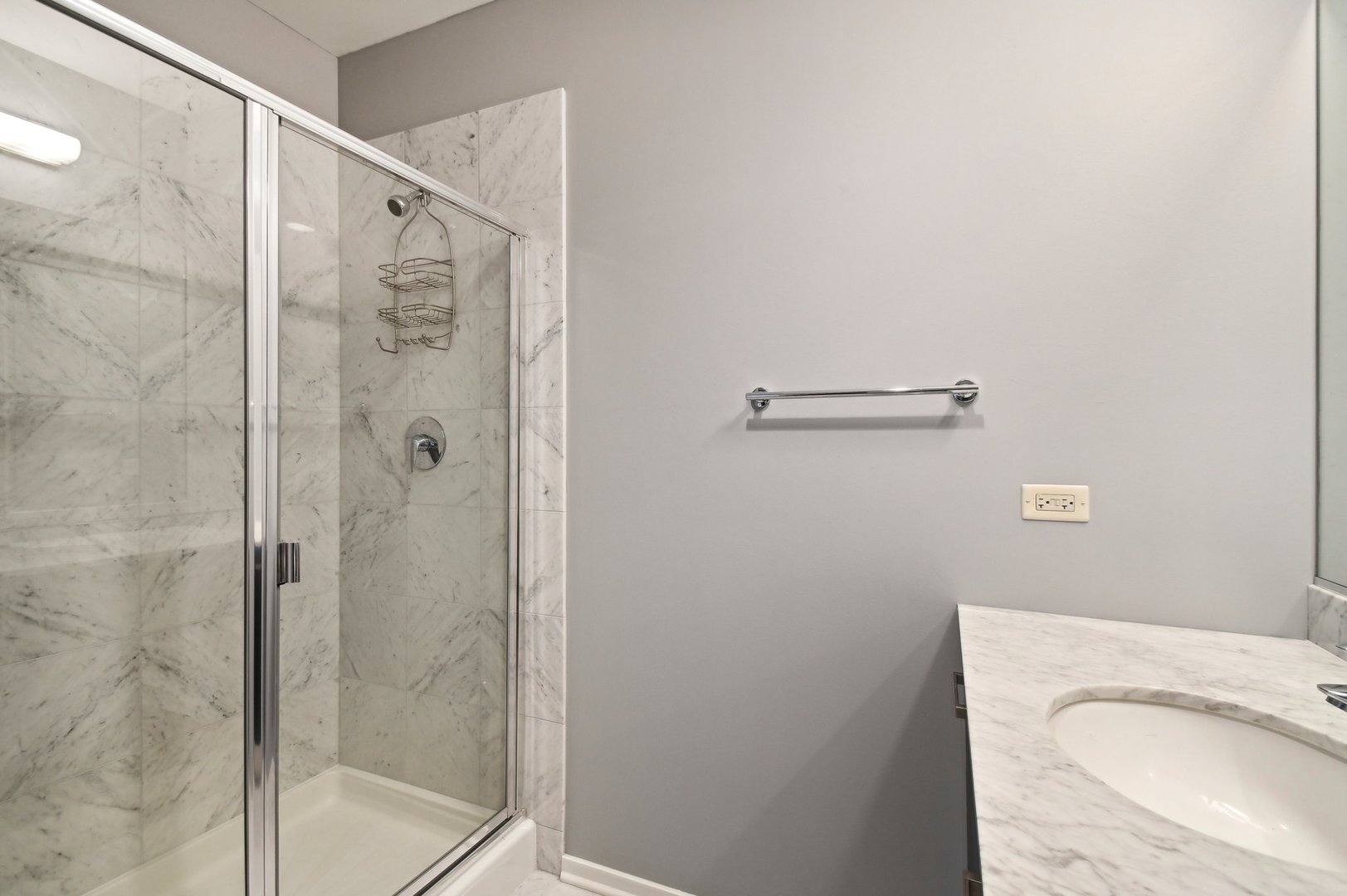 65 East Monroe Street, Unit 4521 Chicago, IL 60603 - Photo 22 of 42 a bathroom with a shower and a sink