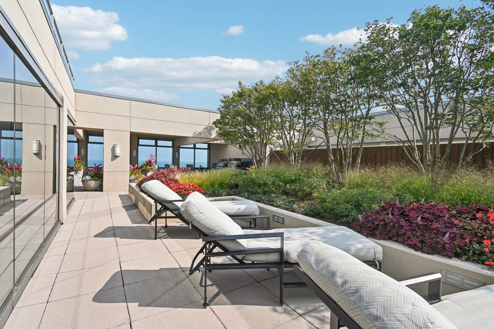65 East Monroe Street, Unit 4521 Chicago, IL 60603 - Photo 27 of 42 a view of a patio with couches table and chairs and potted plants