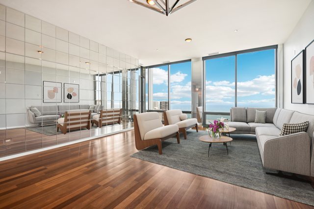 65 East Monroe Street, Unit 4521 Chicago, IL 60603 - Photo 3 of 42 a living room with furniture and a large window