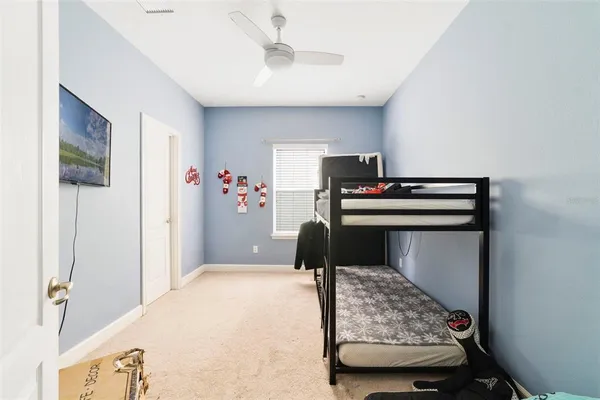 a bedroom with a bed and a couch