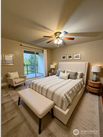 a spacious bedroom with two beds and a chandelier