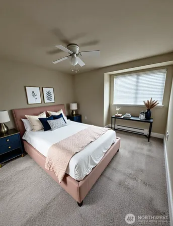 a bedroom with a large bed and a chandelier