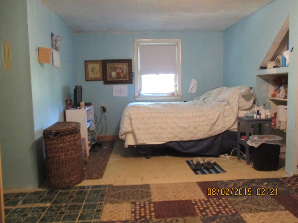 48 Shawsheen Road Billerica, MA 01821 - Photo 12 of 18 a bed sitting in a bedroom next to a window