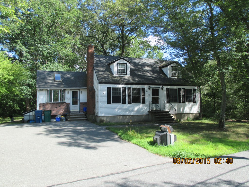 48 Shawsheen Road Billerica, MA 01821 - Photo 3 of 18 a front view of a house with a yard table and chairs