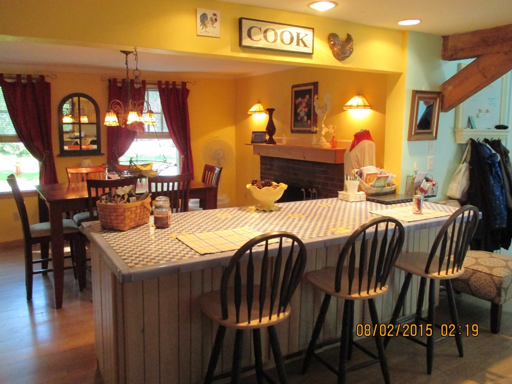 48 Shawsheen Road Billerica, MA 01821 - Photo 7 of 18 a view of a dining room with furniture and wooden floor