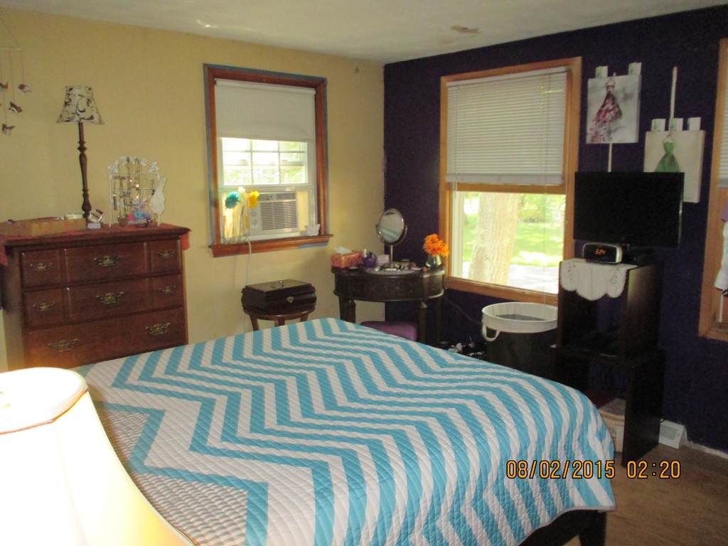 48 Shawsheen Road Billerica, MA 01821 - Photo 10 of 18 a bedroom with a bed and a window