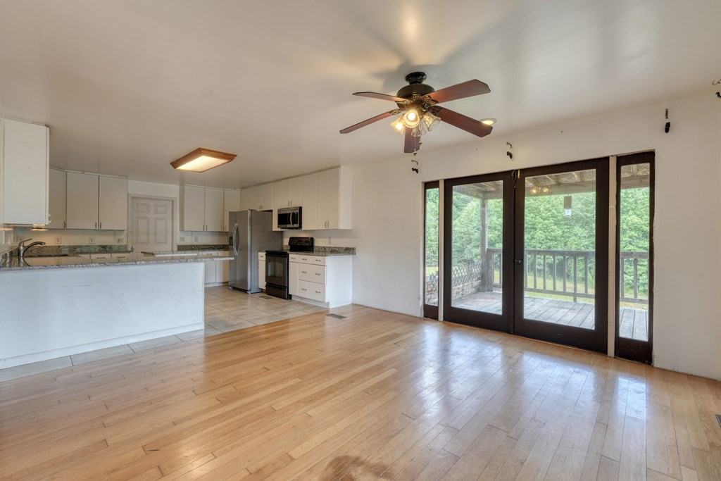 89 Simmons Ridge Mineral Bluff, GA 30559 - Photo 20 of 82 a view of an empty room with window and wooden floor