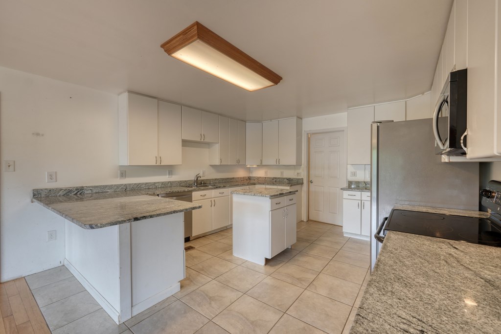 89 Simmons Ridge Mineral Bluff, GA 30559 - Photo 25 of 82 a kitchen with a sink stove and refrigerator
