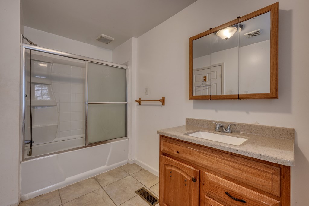 89 Simmons Ridge Mineral Bluff, GA 30559 - Photo 26 of 82 a bathroom with a sink and a mirror