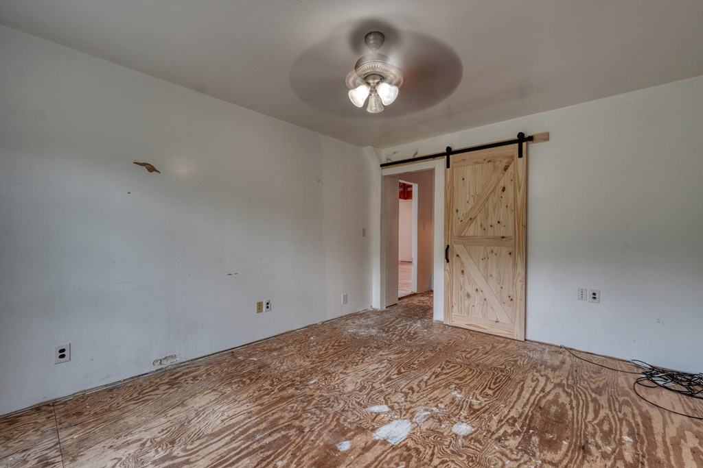 89 Simmons Ridge Mineral Bluff, GA 30559 - Photo 30 of 82 a view of a room with a chandelier fan and a window