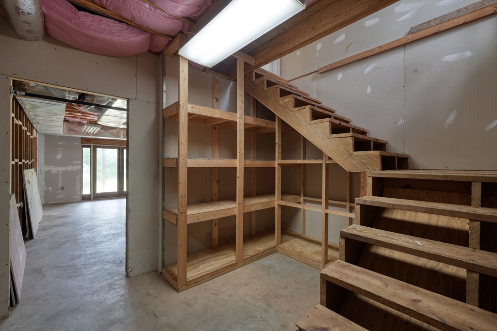 89 Simmons Ridge Mineral Bluff, GA 30559 - Photo 49 of 82 a view of an empty room with wooden floor and windows