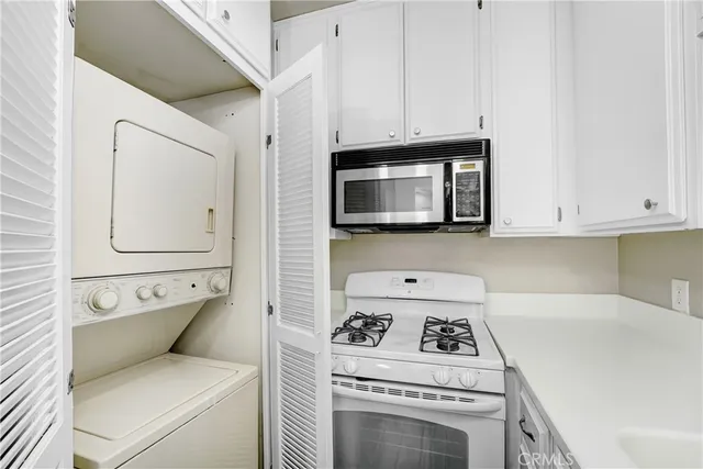 a kitchen with a stove and a microwave