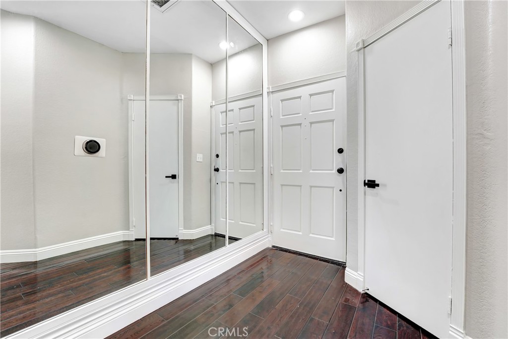 6140 Monterey Road, Unit 406 Los Angeles, CA 90042 - Photo 15 of 26 a view of a hallway with wooden floor and staircase