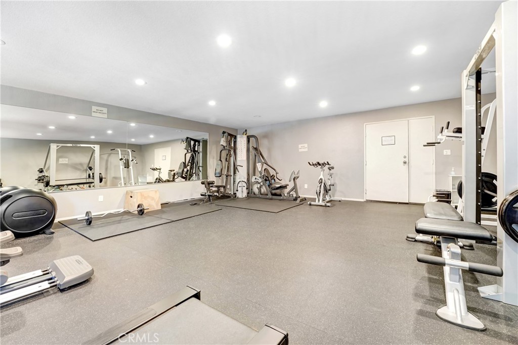 6140 Monterey Road, Unit 406 Los Angeles, CA 90042 - Photo 17 of 26 a room with gym equipment and a view of living room