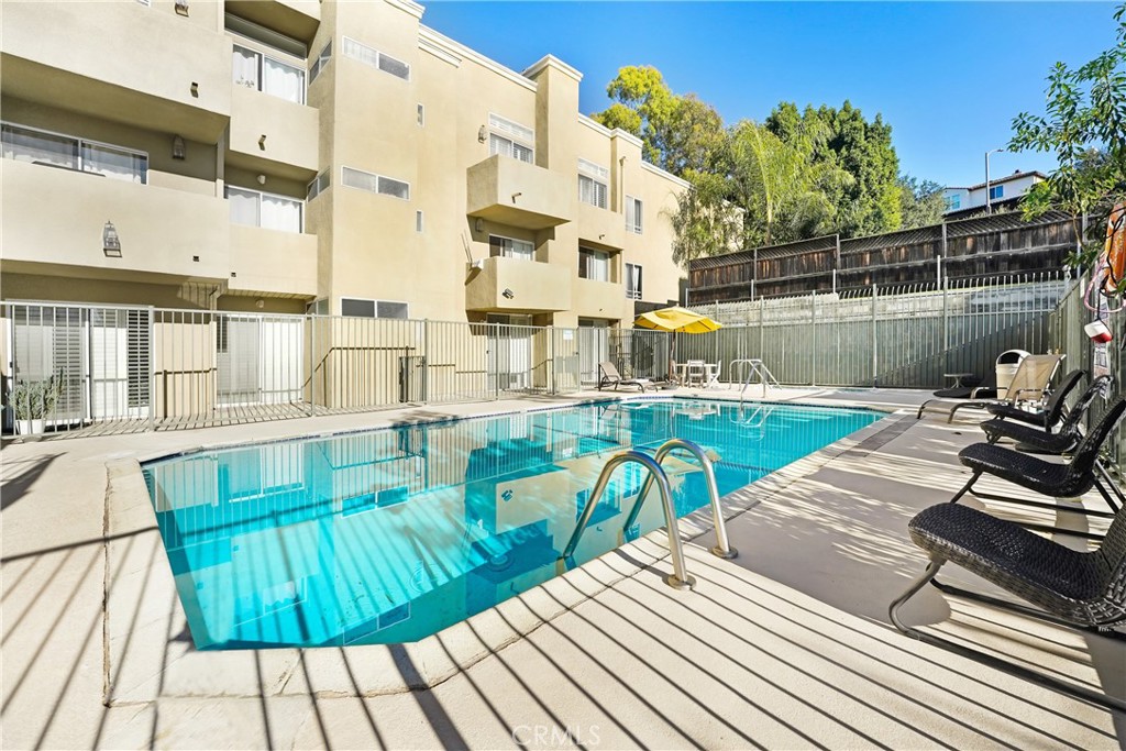 6140 Monterey Road, Unit 406 Los Angeles, CA 90042 - Photo 19 of 26 a view of a swimming pool with a patio