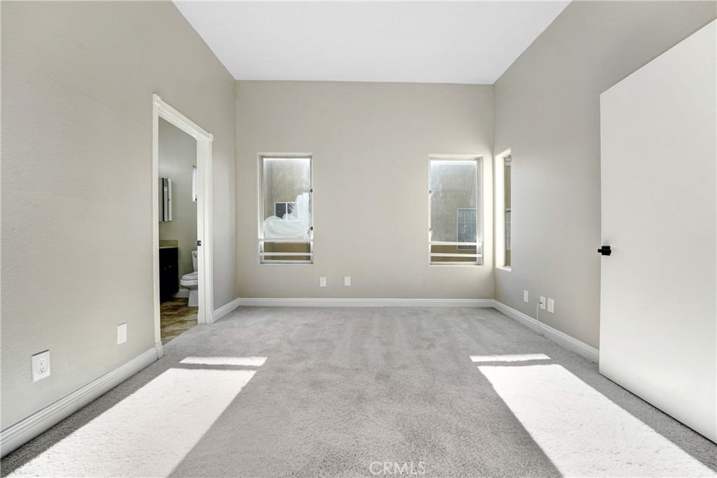 6140 Monterey Road, Unit 406 Los Angeles, CA 90042 - Photo 8 of 26 an empty room with windows and entrance