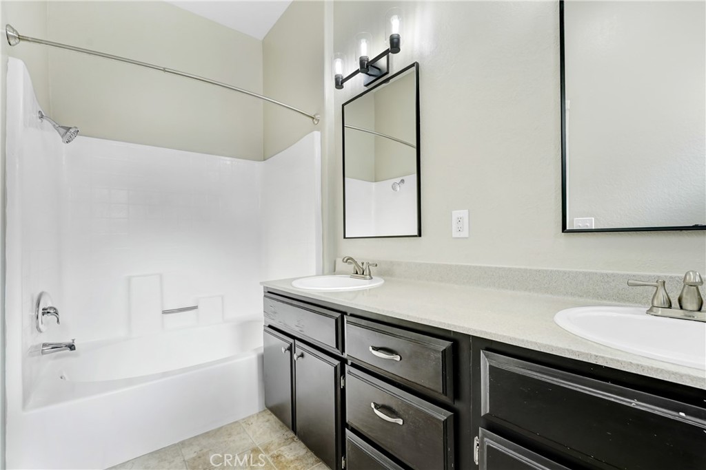 6140 Monterey Road, Unit 406 Los Angeles, CA 90042 - Photo 10 of 26 a bathroom with a sink and a mirror