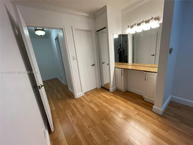 a view of a bathroom from a hallway
