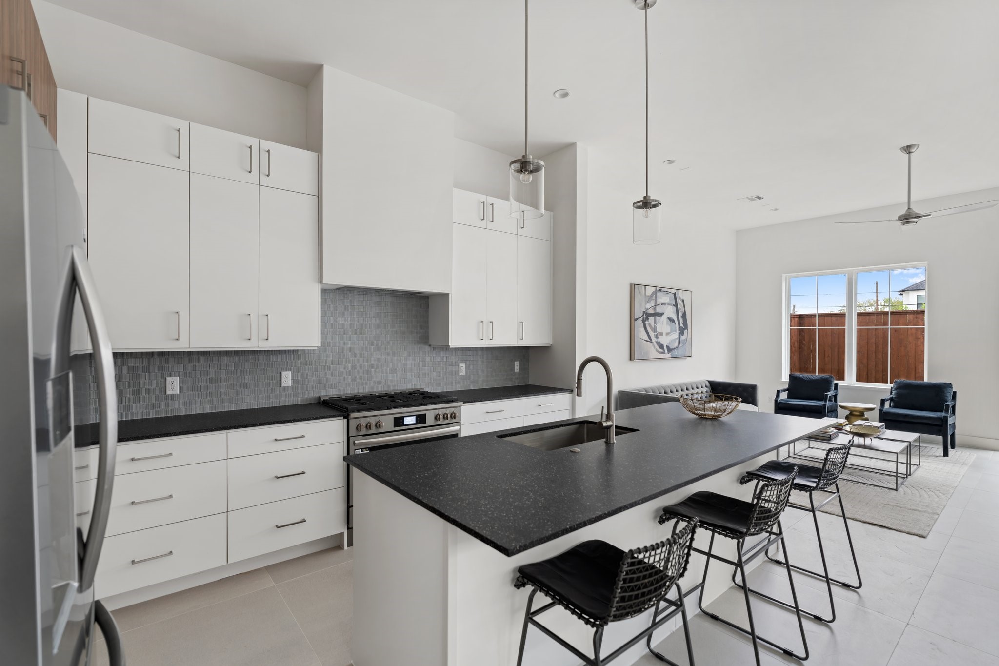 111 East 32nd Street, Unit C Houston, TX 77018 - Photo 11 of 31 Striking statement tile backsplash and LaNova countertops add personality and style to this well-appointed space.