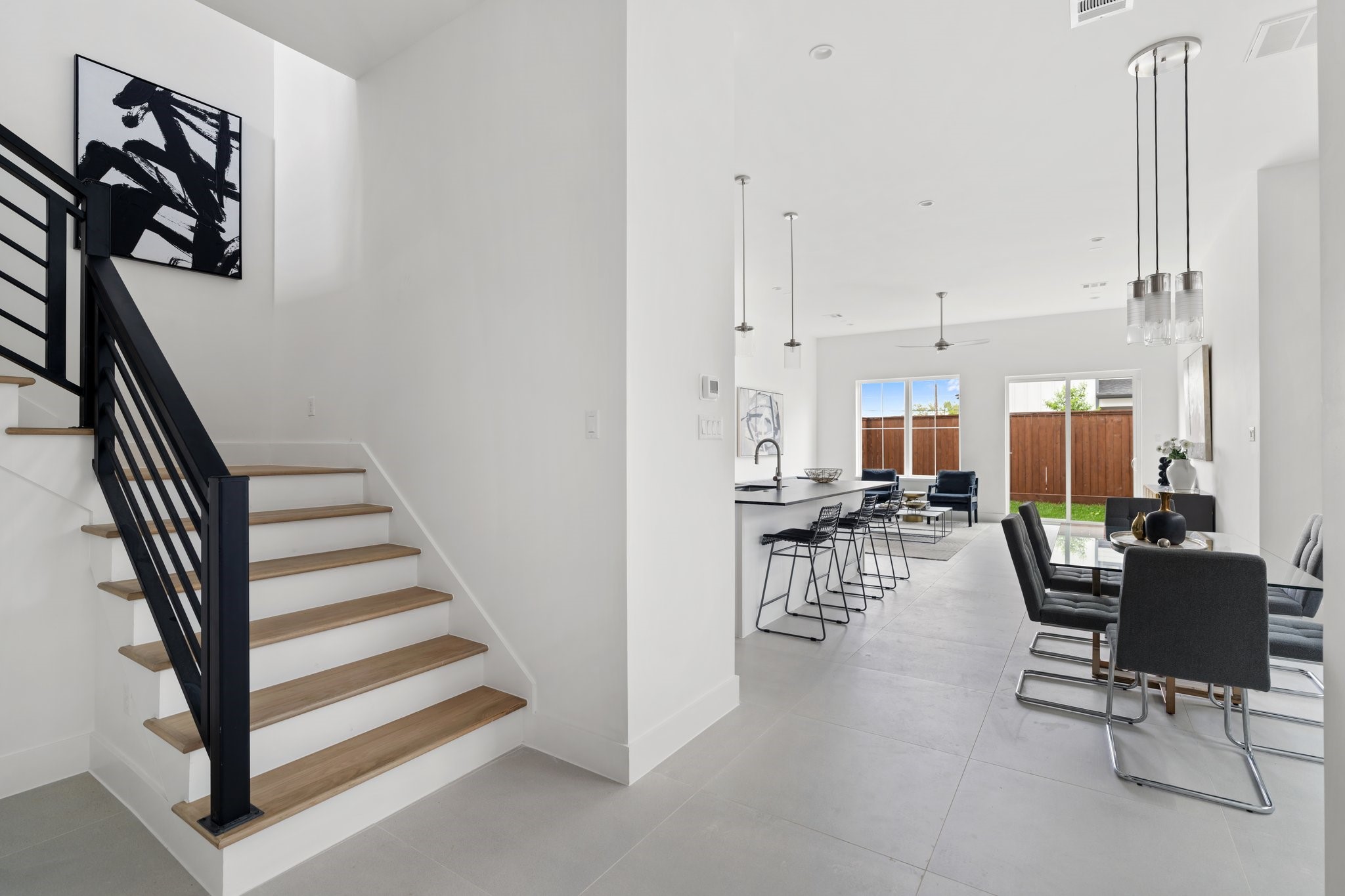 111 East 32nd Street, Unit C Houston, TX 77018 - Photo 14 of 31 A sleek and modern staircase leads to the second floor, continuing the home's sophisticated design.