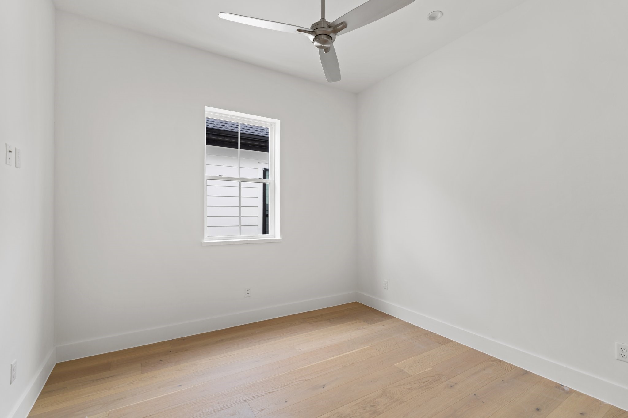 111 East 32nd Street, Unit C Houston, TX 77018 - Photo 25 of 31 Designed for comfort, this bedroom includes a private walk-in closet and pre-wiring for cable.