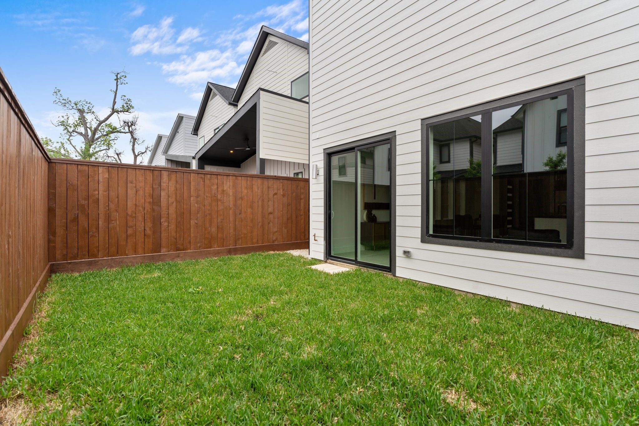 111 East 32nd Street, Unit C Houston, TX 77018 - Photo 29 of 31 The front and back yards are professionally landscaped and thoughtfully designed with underground French drains for superior drainage