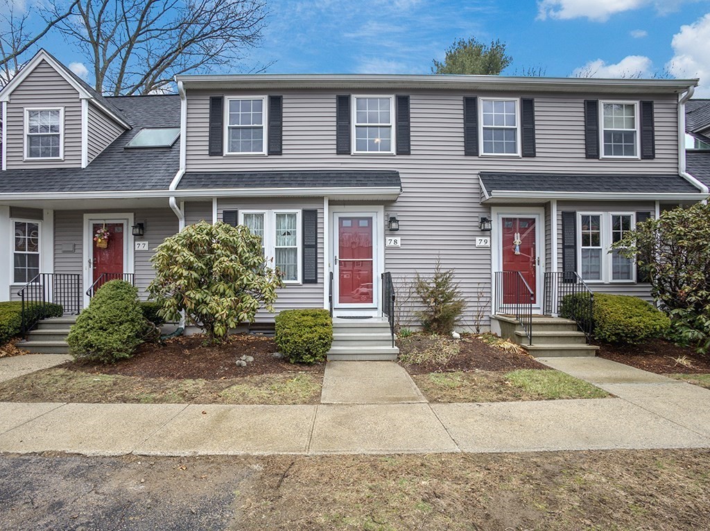 78 Key Street, Unit 78 Millis, MA 02054 - Photo 1 of 33 a front view of a house with garden