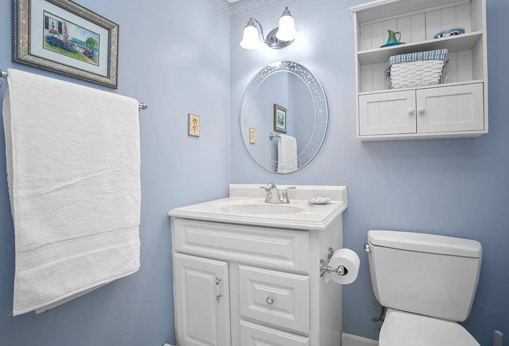 78 Key Street, Unit 78 Millis, MA 02054 - Photo 16 of 33 a bathroom with a toilet a sink and a mirror