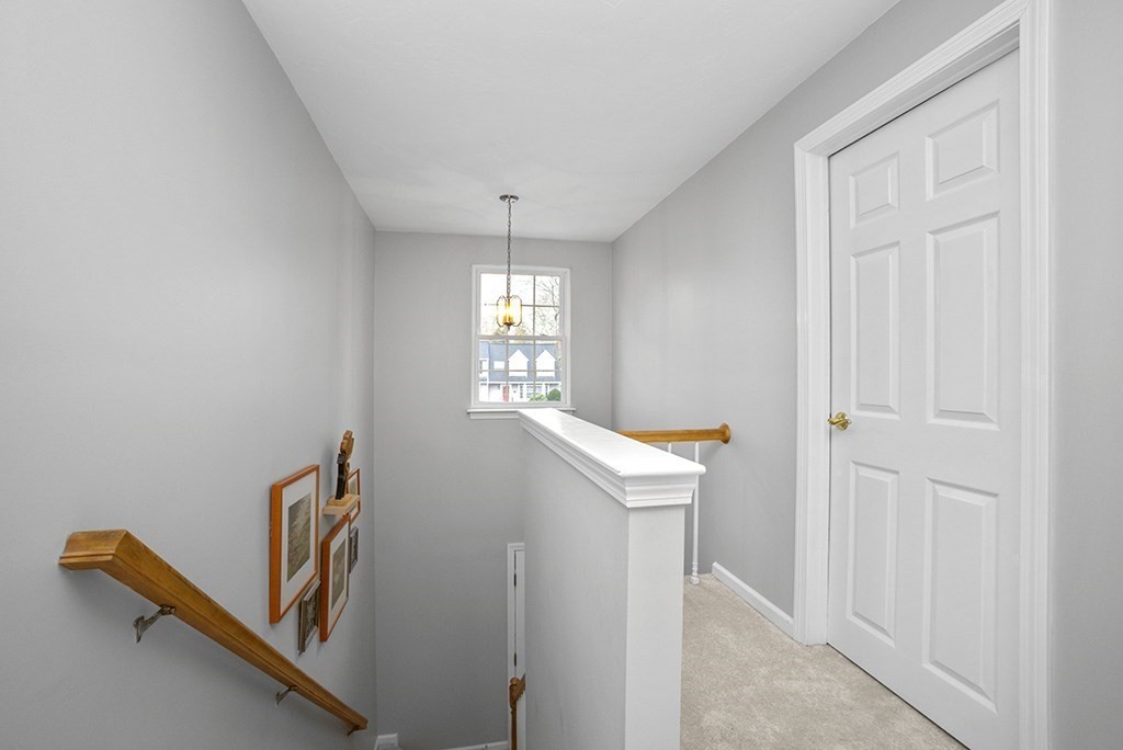 78 Key Street, Unit 78 Millis, MA 02054 - Photo 18 of 33 a view of a hallway with windows
