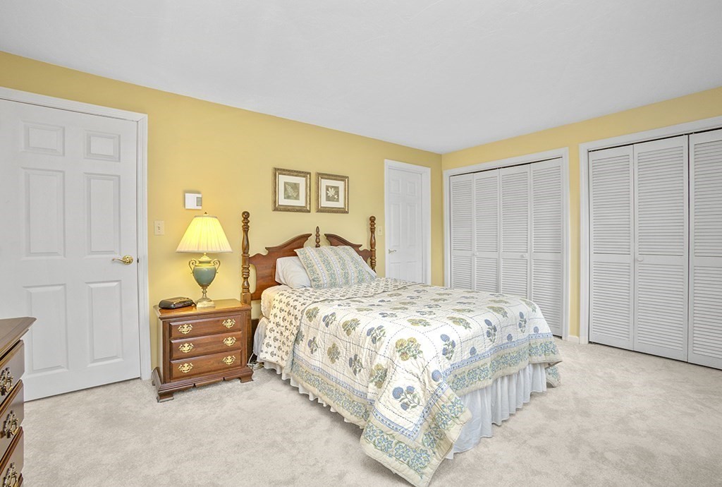 78 Key Street, Unit 78 Millis, MA 02054 - Photo 20 of 33 a bedroom with a bed and a cabinets