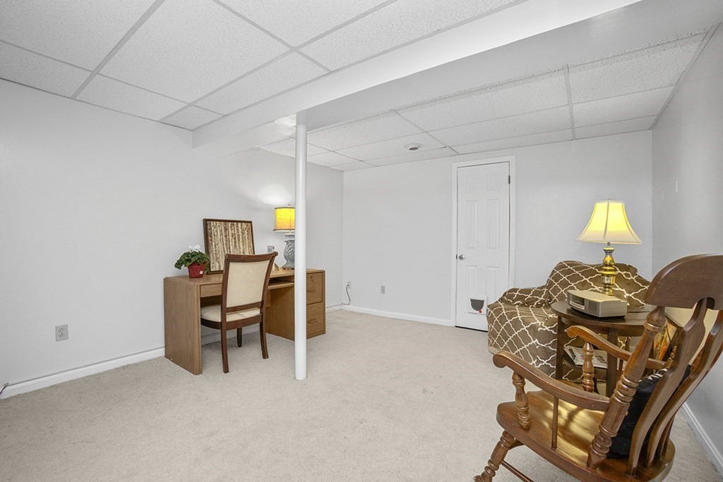 78 Key Street, Unit 78 Millis, MA 02054 - Photo 24 of 33 a living room with furniture and a window