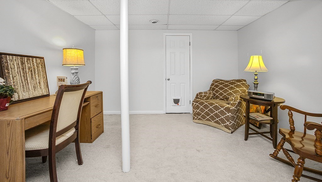 78 Key Street, Unit 78 Millis, MA 02054 - Photo 25 of 33 a living room with furniture and a lamp